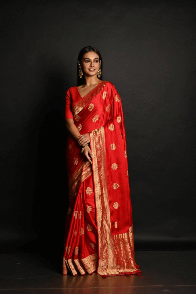 Types of Sarees Names: Saree Varieties From Across India 2 Traditional Banarasi saree in red silk with gold zari border.