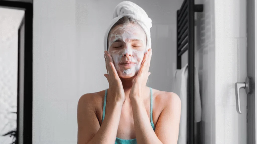 Korean Beauty Hacks for Glowing Skin: 15 Powerful K-Beauty Tips to Transform Your Skin 2 Woman using oil cleanser followed by foam cleanser.